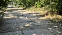 Новости » Общество: Дорога по улице Желябова нуждается в асфальтировании